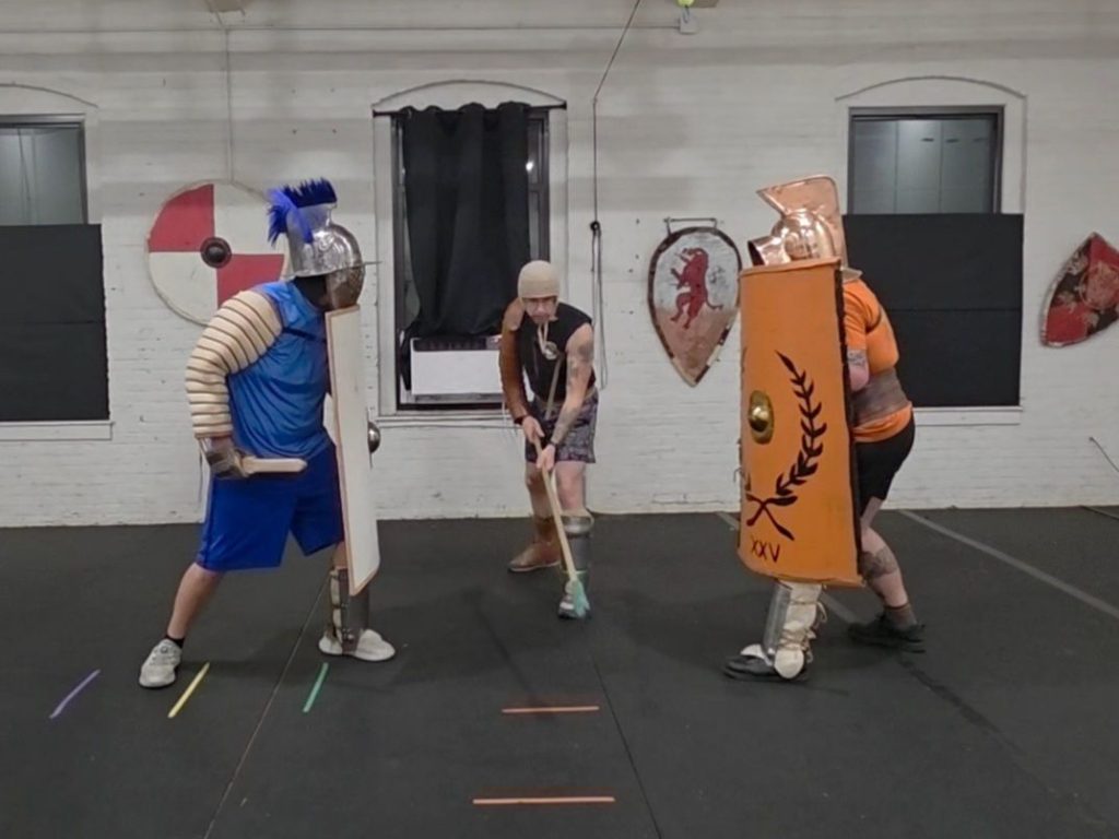 two people as gladiators